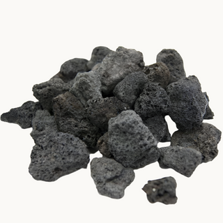 Loose Lava-Fyre Coals displayed beside the bag for use at the base of a gas log fireplace