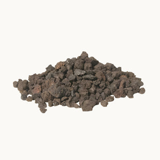 Loose Real Fyre Lava-Fyre Granules spread out on a white background, showing texture and size