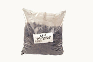 bag of Real Fyre Lava-Fyre Granules used to decorate gas fireplace floor