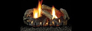 Realistic Empire Stacked Aged Oak vent-free gas logs burning with tall yellow flames on black background, ideal for 27–30 inch fireplaces